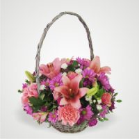 Pink Lilies Asters Carnations and Roses in a Basket
