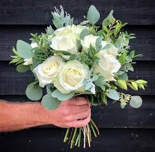 Bride bouquet White roses and pennygum