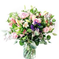 Pink And Purple Roses Lilies Astromeria Pennygum And Status In A Small Vase